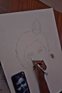 Outlining the baby krishna painting